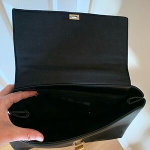 Black handbag with gold/metal fixture